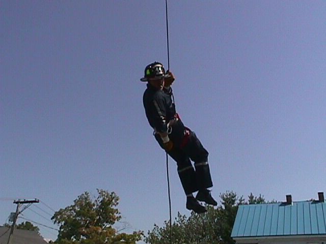 Firefighter Brian Cousino rappelling during High Angle Rescue Training